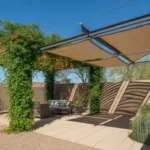 Backyard shade structure with geometric panels and climbing vines in Gilbert, Arizona