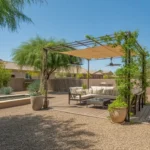 A shaded patio with heat-resistant materials and cooling features in Gilbert, Arizona