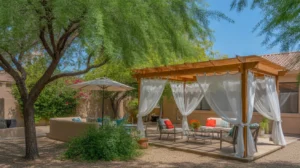 A cool and shady backyard oasis in Gilbert with a pergola, shade trees, and lush plants