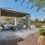 A shaded patio with a pergola and misting system in a Southeast Valley backyard