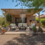 A shaded patio with seating and cooling features for summer outdoor living in Gilbert.